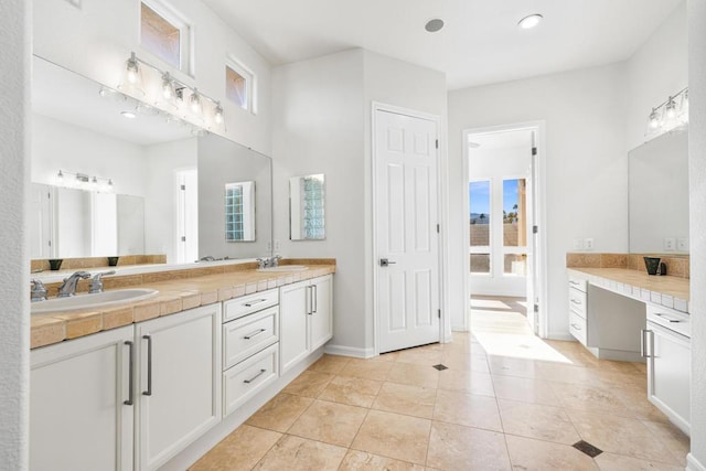 bathroom featuring vanity, tile patterned flooring, and plenty of natural light