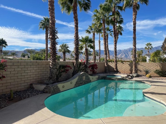 view of pool with a mountain view