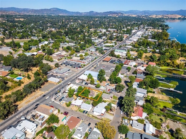 birds eye view of property featuring a residential view and a water and mountain view