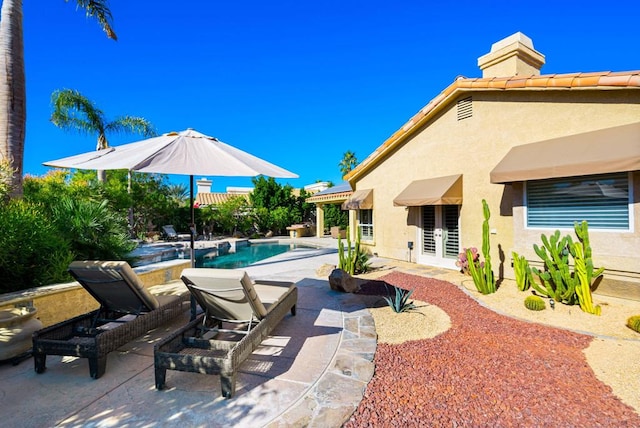 view of swimming pool with a patio