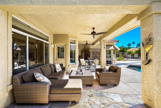 view of patio featuring ceiling fan and an outdoor living space