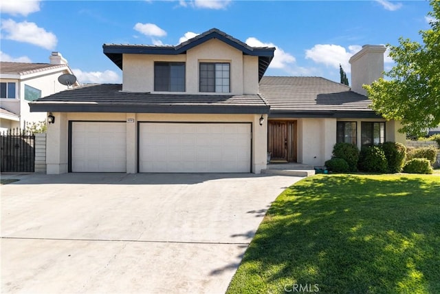 front facade with a front yard and a garage