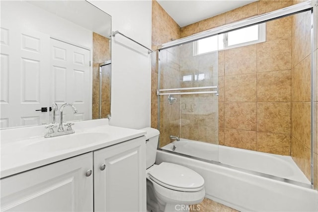 full bathroom featuring bath / shower combo with glass door, toilet, and vanity