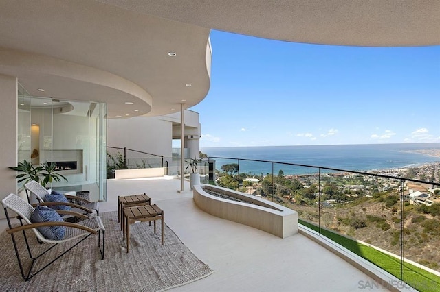 balcony featuring a water view