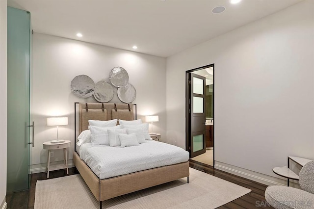 bedroom with wood-type flooring