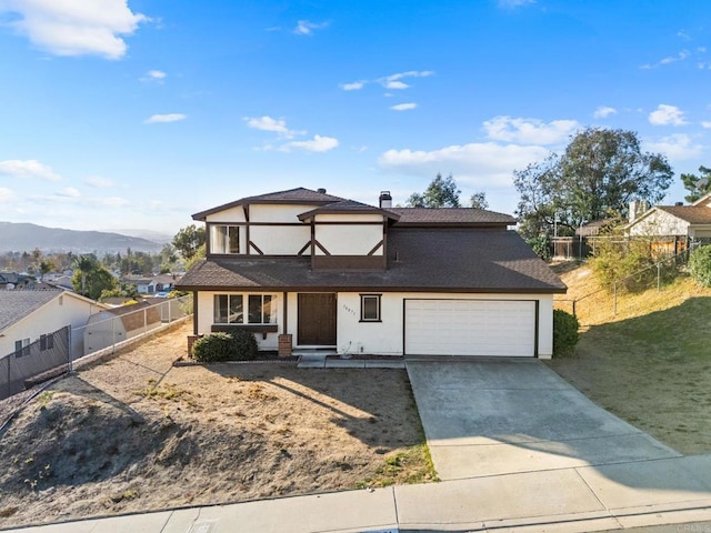 view of front of house featuring a mountain view and a front yard