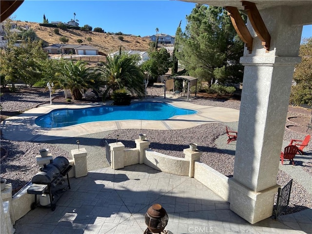 pool featuring a patio area