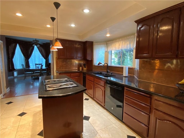 kitchen featuring black dishwasher, dark countertops, a sink, and stainless steel electric cooktop