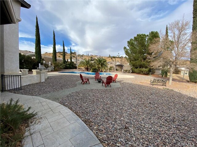 view of yard with a patio area and an outdoor pool