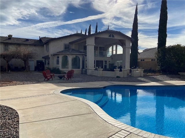 outdoor pool featuring a patio