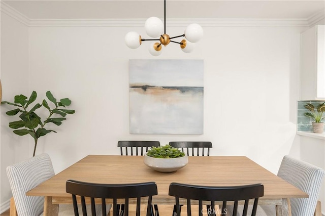 dining area with a notable chandelier and ornamental molding