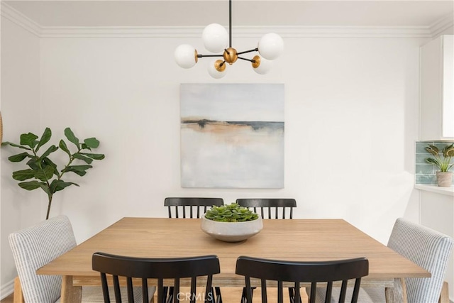 dining space featuring a notable chandelier and ornamental molding