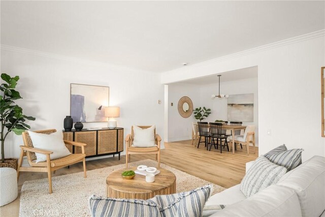 living room featuring crown molding and wood-type flooring