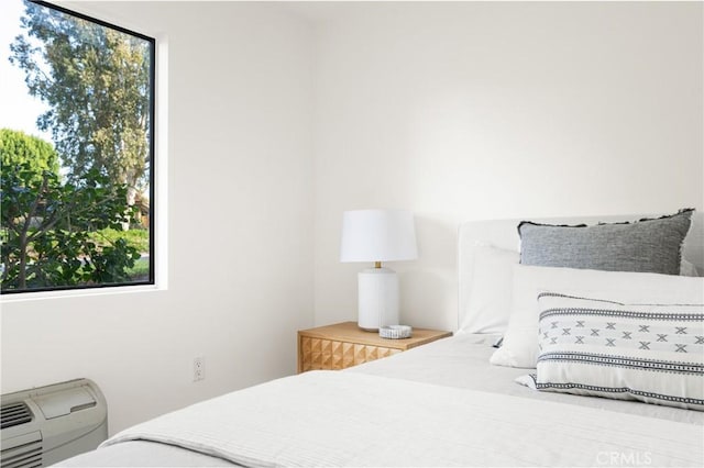 bedroom featuring multiple windows
