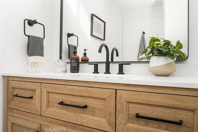 bathroom with double vanity and a sink