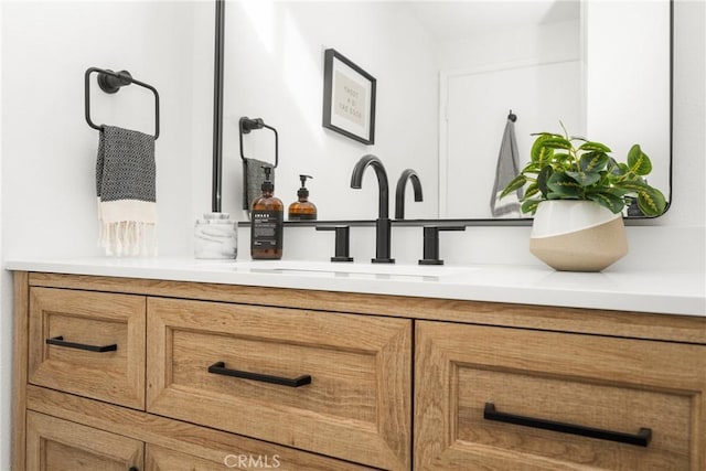 bathroom featuring double vanity and a sink