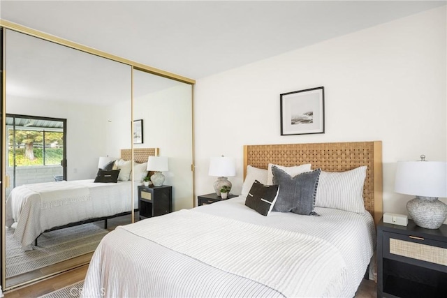 bedroom featuring a closet and wood finished floors