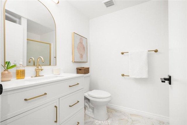 full bathroom with visible vents, toilet, marble finish floor, baseboards, and vanity