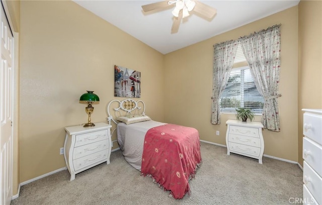 bedroom featuring ceiling fan and light colored carpet