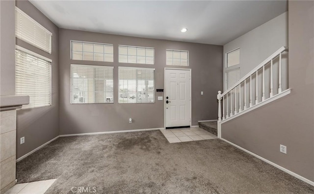 view of carpeted foyer