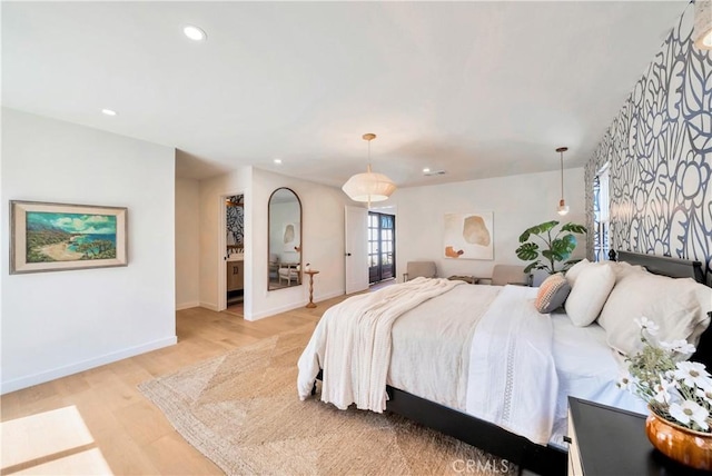 bedroom featuring light wood finished floors, baseboards, and recessed lighting