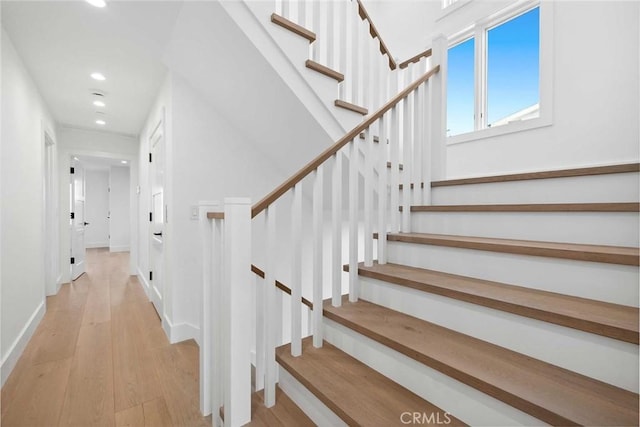 staircase featuring hardwood / wood-style floors