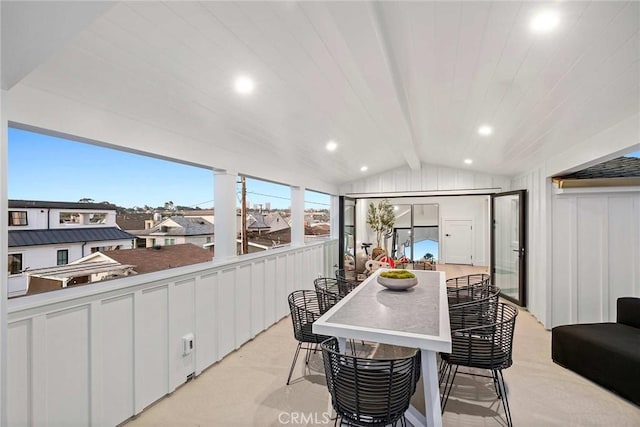 dining area with lofted ceiling