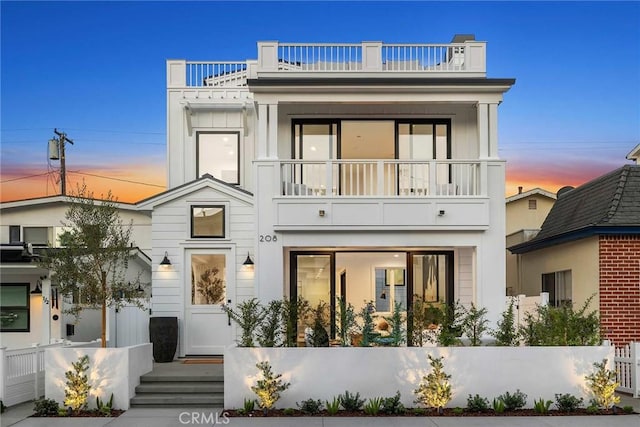 view of front of home featuring a balcony