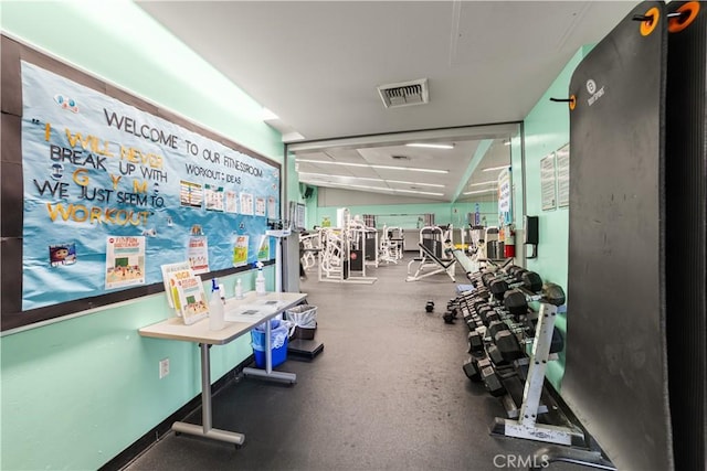 exercise room featuring lofted ceiling