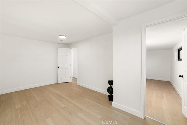 spare room with light wood-type flooring