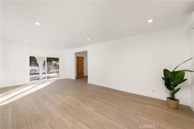 empty room with light hardwood / wood-style floors