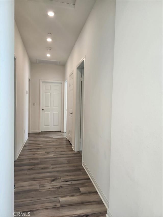 hall with dark hardwood / wood-style floors