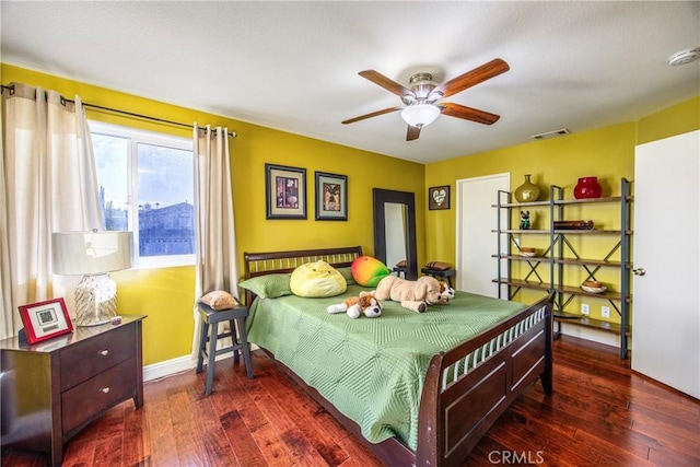 bedroom featuring ceiling fan and dark hardwood / wood-style flooring