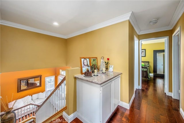 corridor featuring dark hardwood / wood-style flooring and ornamental molding