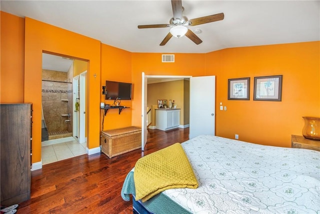 bedroom featuring ensuite bath, ceiling fan, and hardwood / wood-style flooring