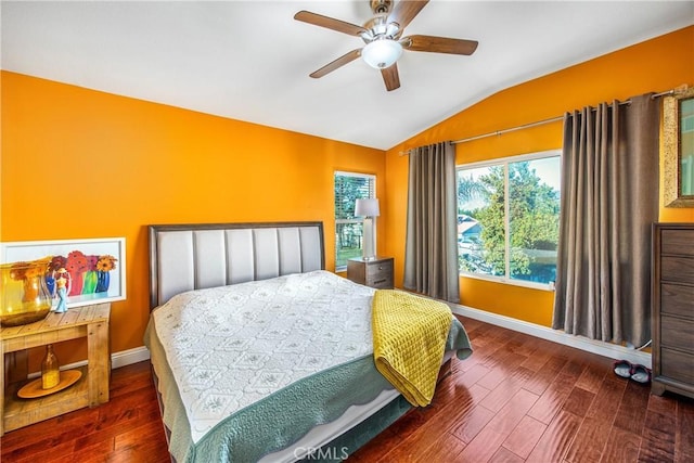 bedroom with ceiling fan, lofted ceiling, and dark hardwood / wood-style floors