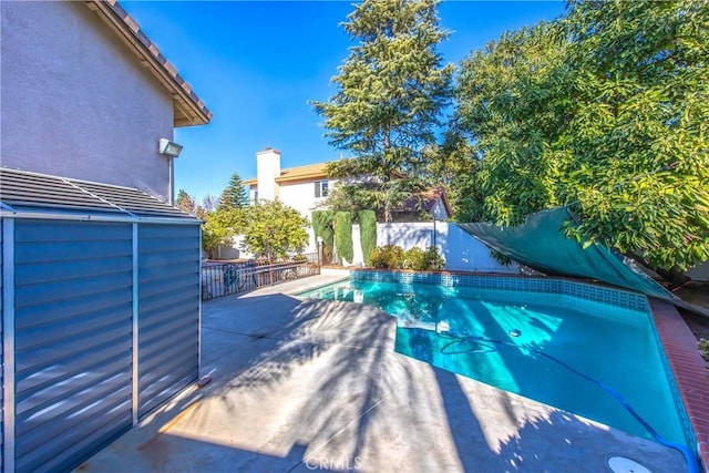 view of swimming pool with a patio area