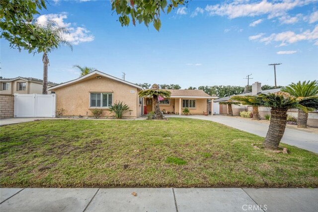 ranch-style house with a front yard