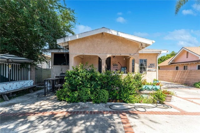 view of front of home with a patio area