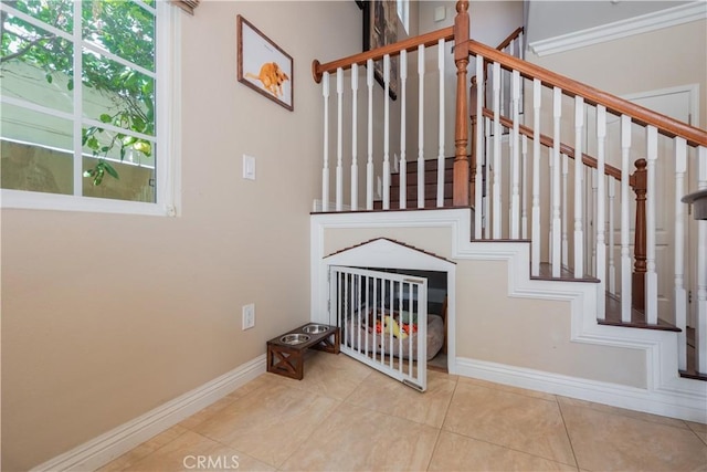 stairway with tile patterned floors