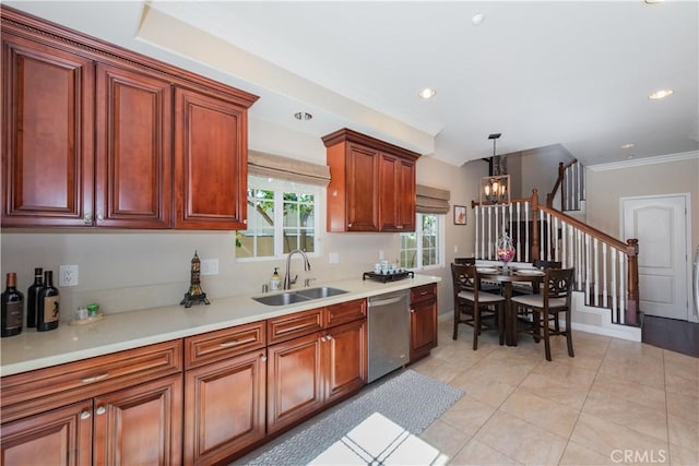 kitchen with decorative light fixtures, sink, dishwasher, light tile patterned floors, and crown molding