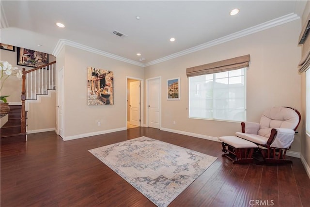 living area featuring dark wood-type flooring and crown molding