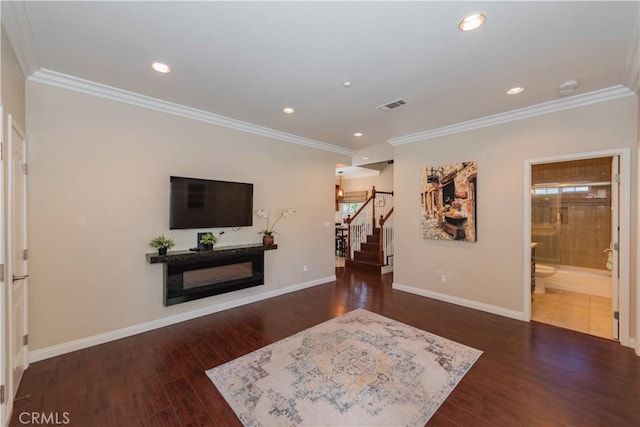 living room featuring ornamental molding and dark hardwood / wood-style floors