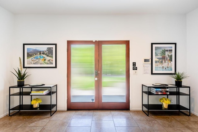 doorway featuring light tile patterned floors and french doors