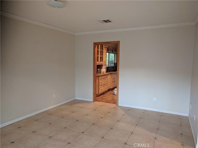 spare room with ornamental molding