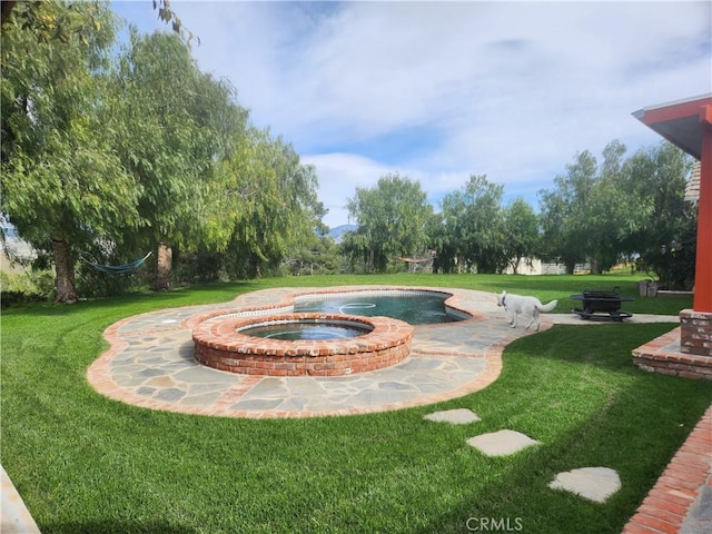 view of pool with a yard