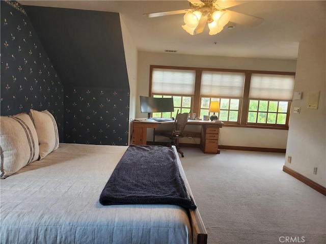 bedroom with ceiling fan and light colored carpet