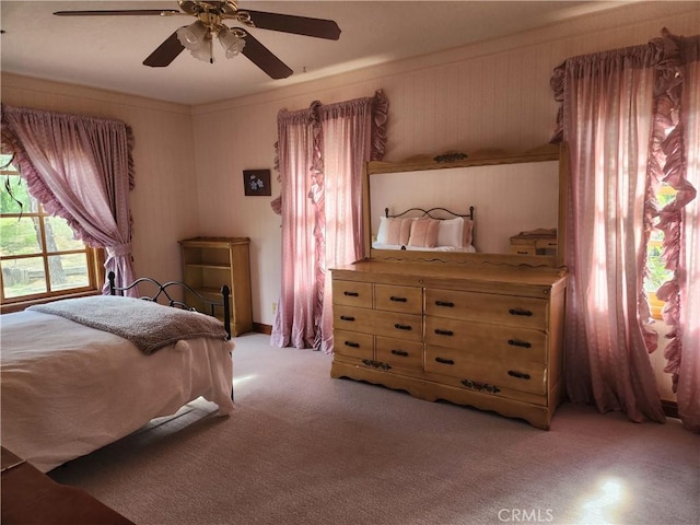 bedroom featuring ceiling fan and light colored carpet