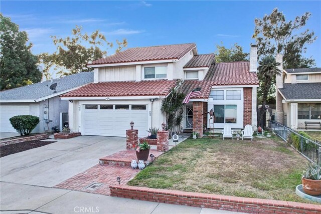 view of front of home with a garage and a front yard