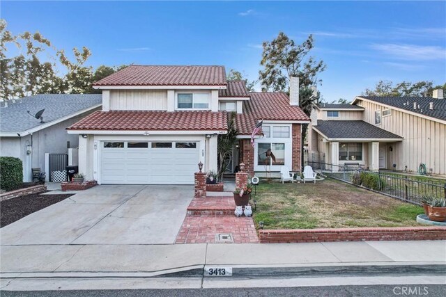 view of front of property with a front lawn and a garage